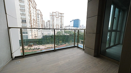 Photo of a modern apartment with a spacious balcony.