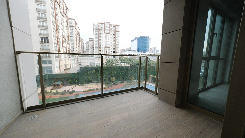 Photo of a modern apartment with a spacious balcony.