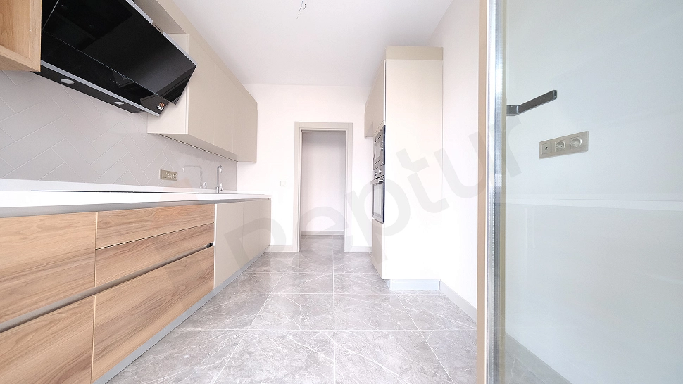 Modern designed, unfurnished kitchen.