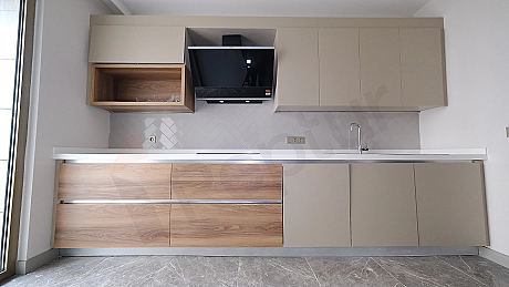 Detail of modern kitchen countertop and cabinets.