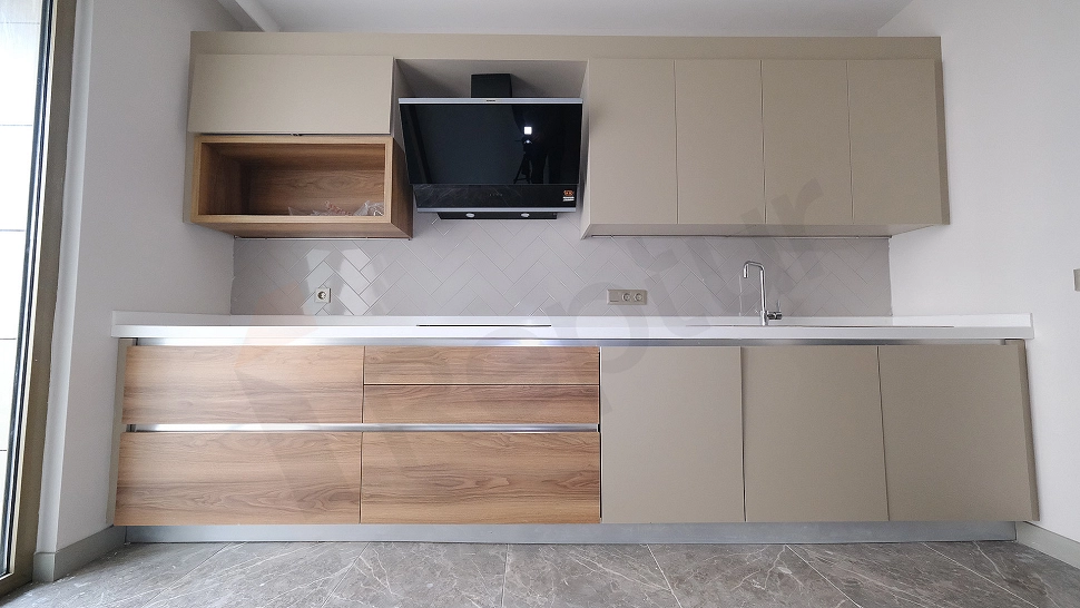 Detail of modern kitchen countertop and cabinets.