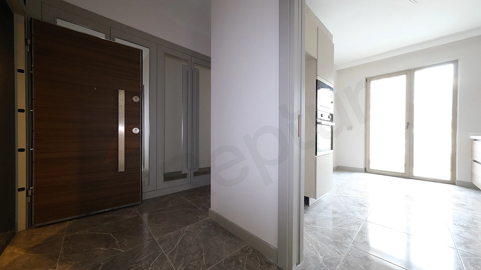 Apartment entrance door and hallway detail.