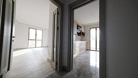 Detail of a modern kitchen counter and cabinets.