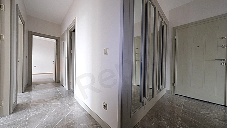 Spacious and bright apartment corridor.