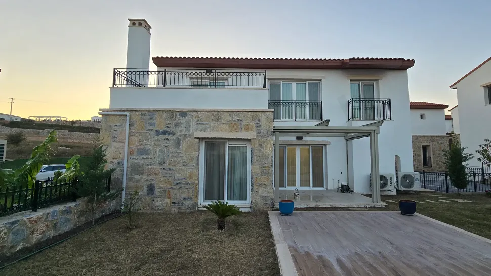 Exterior view of a modern two-story luxury villa with a garden located in Milas, Muğla.