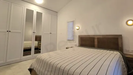 Modern and comfortably furnished bedroom image of a 3+1 villa for sale in Milas, Muğla.