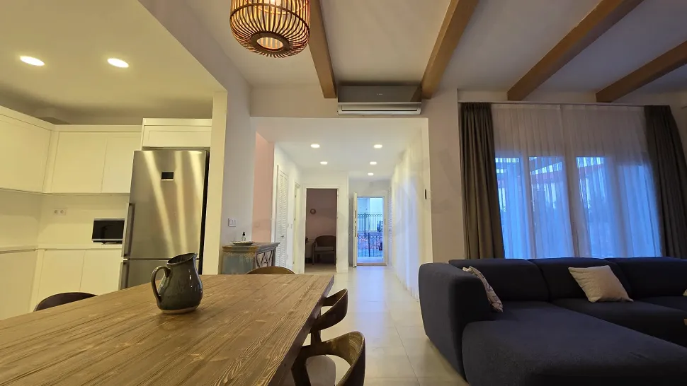 A spacious and bright furnished bedroom image decorated with modern furniture.