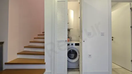 Modern and stylishly decorated furnished villa corridor.