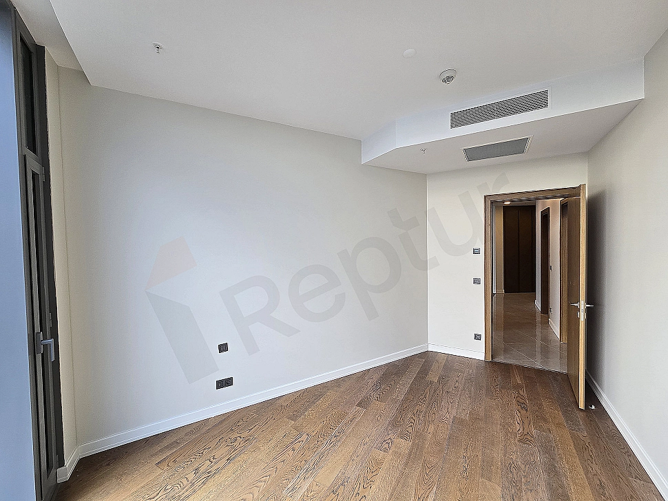 Interior view of a modernly designed, bright, and spacious bedroom.