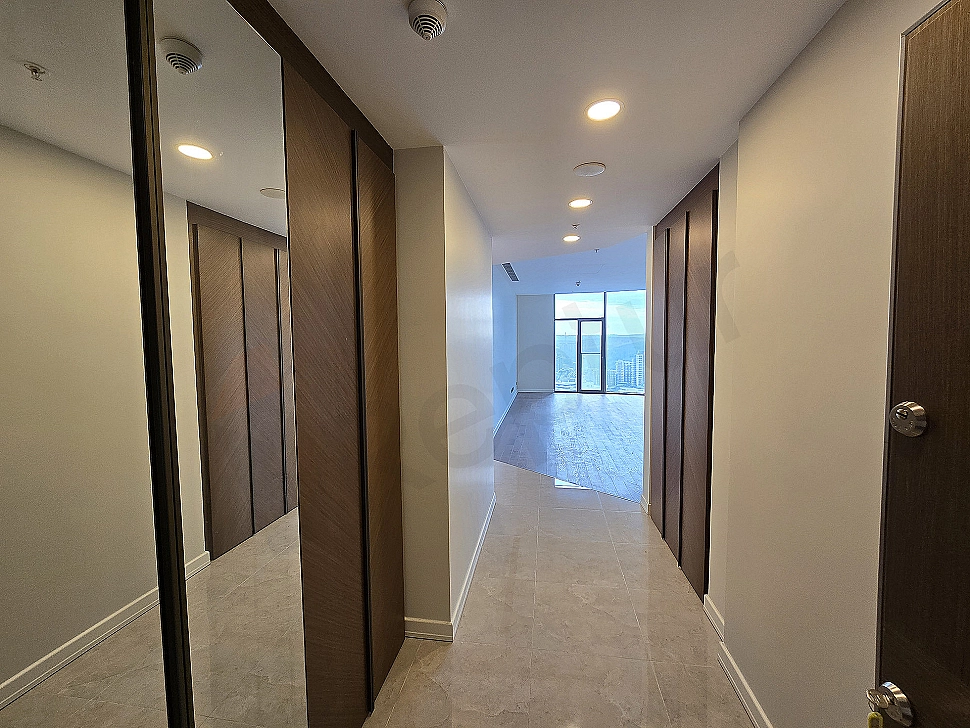 Modern designed apartment entrance hall, wooden door, mirrored cloakroom and lighting details