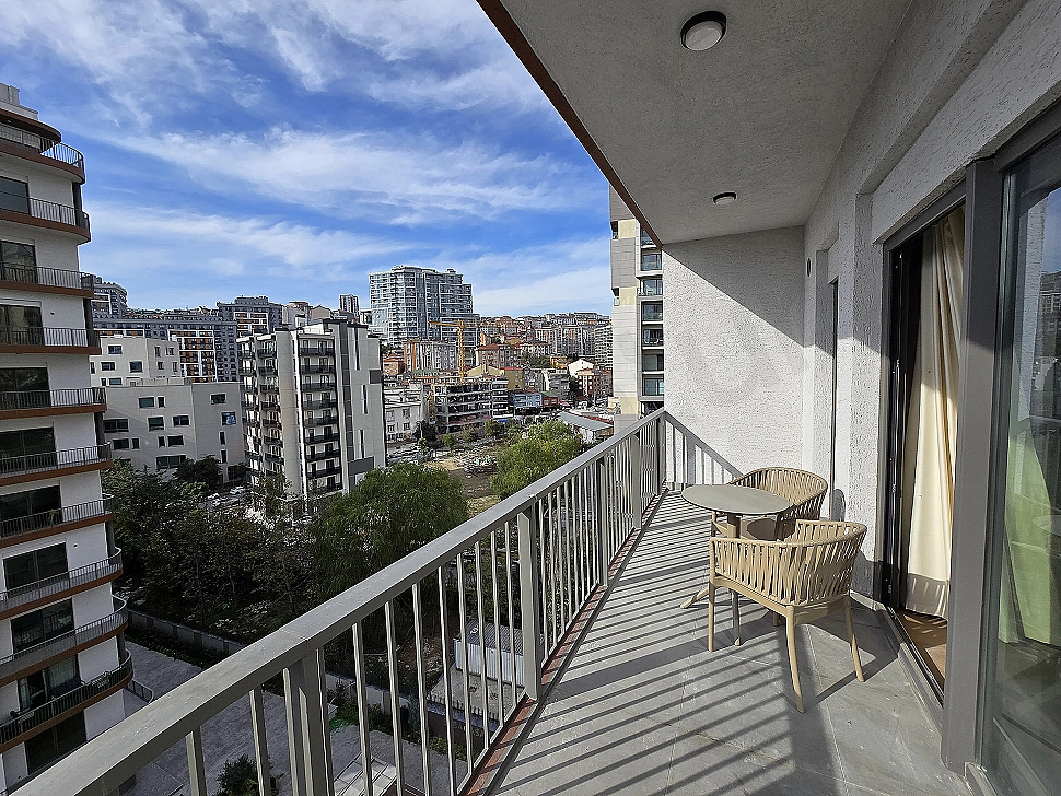 Furnished terrace view. Terrace seating area, plants, and city view.
