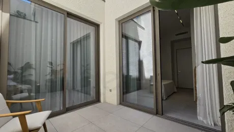 Modern open-air terrace area located above an inner garden.
