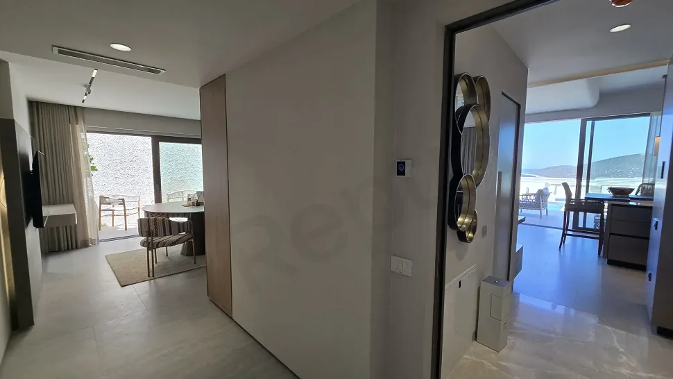 View of a spacious and bright hallway inside a modern villa.
