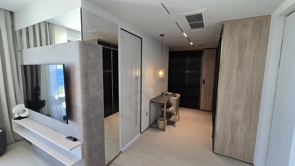 A spacious and bright luxury villa corridor designed with modern architecture.
