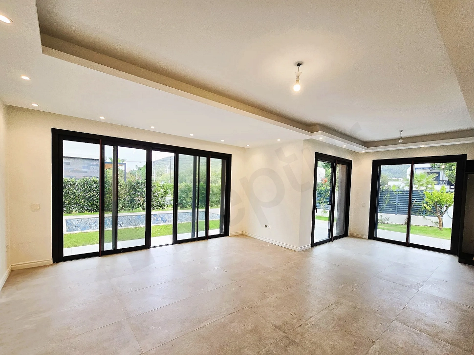 Spacious and bright living room area of a modern hotel in Bodrum.