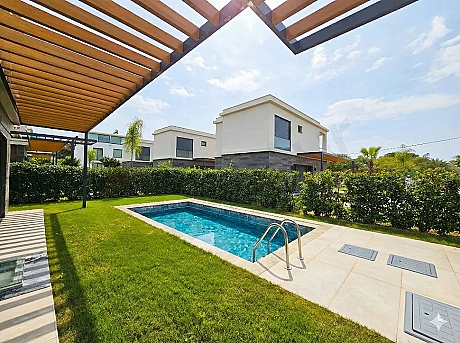 A modern and spacious swimming pool located in the garden of a hotel in Bodrum.