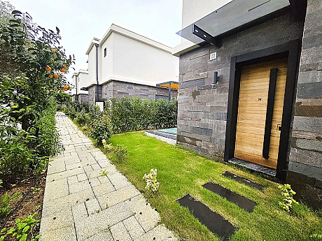 Entrance door and hallway detail of a modern apartment unit.