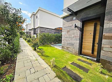 Entrance door and hallway area of an apartment in a modern building.