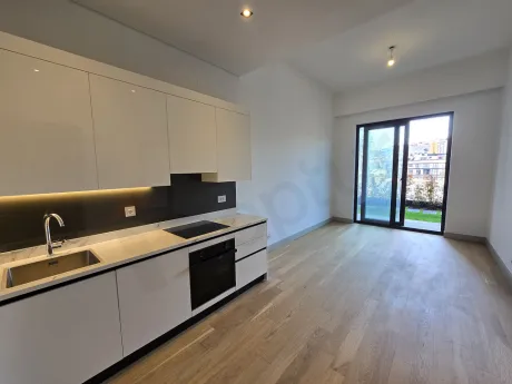 A spacious living room area with modern design and large windows.
