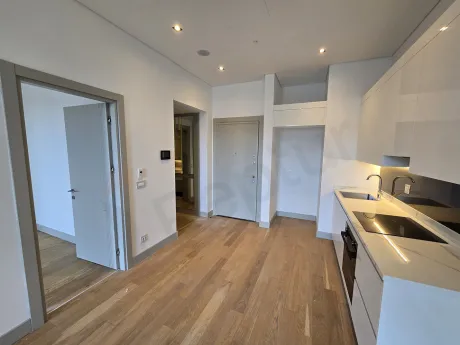 Spacious and bright dining room area, modern interior design with natural light windows.