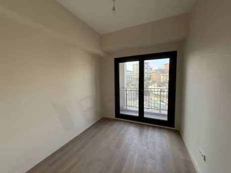 Interior view of a modern, spacious, and bright bedroom.