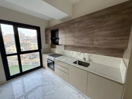 Spacious and bright kitchen area with a modern design.