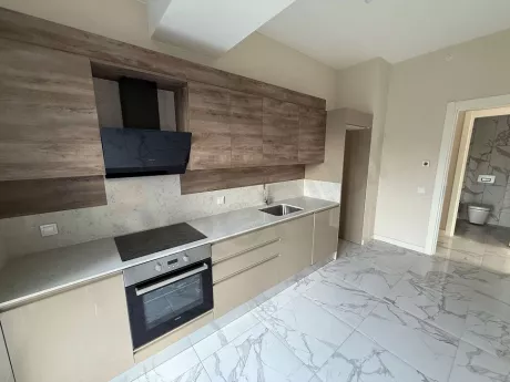 Spacious and bright kitchen area with a modern design.