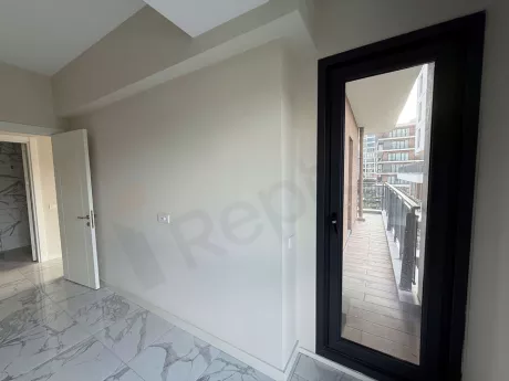 Spacious and airy balcony of a modern apartment with a city view in Cekmekoy, Istanbul.