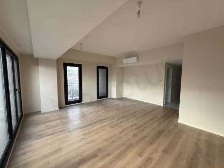 Spacious and bright dining room area in a modern apartment.
