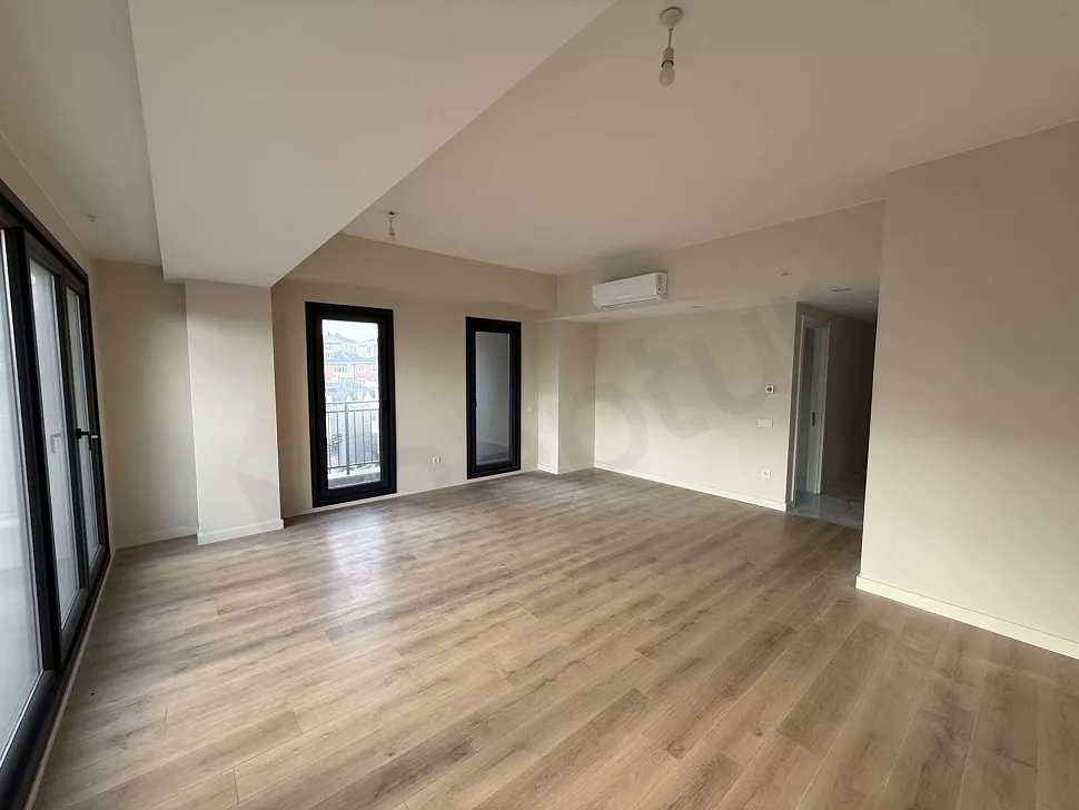 Spacious and bright dining room area in a modern apartment.