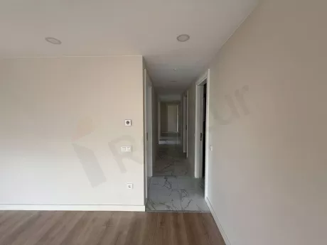 Modern, spacious, and bright hallway of an apartment unit.