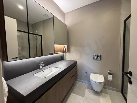 Modern and stylishly designed bathroom area covered with quality ceramics.