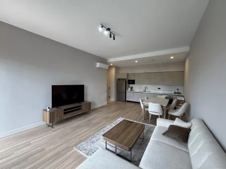 Design of a spacious and bright living room furnished with modern furniture.