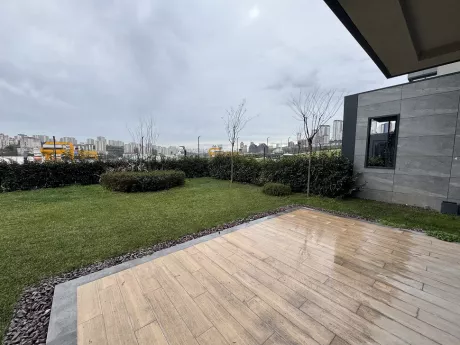 A large and spacious terrace area furnished with modern furniture.