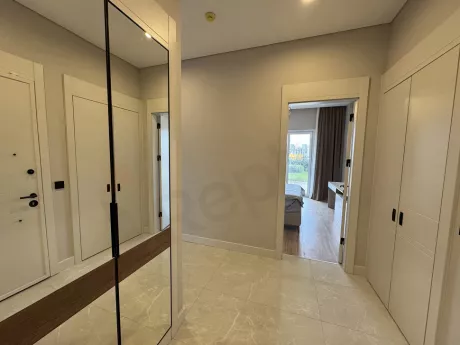 Spacious, bright and stylishly designed corridor view of a modern apartment.