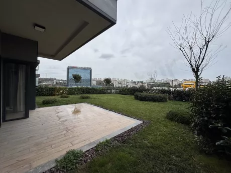 Spacious and airy terrace area furnished with modern furniture and offering city views.