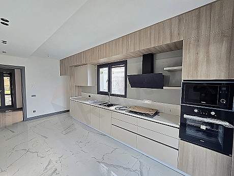 Image of a modern designed, spacious and bright villa kitchen.