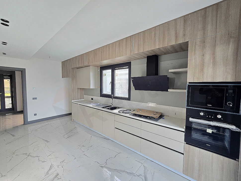Image of a modern designed, spacious and bright villa kitchen.