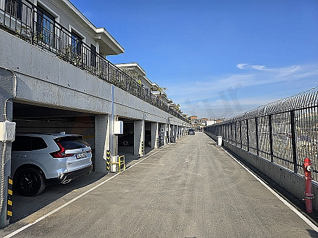 Photo of an open parking area.