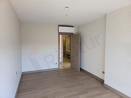 Stylish and modern designed bedroom interior with luxurious details and comfortable bed.