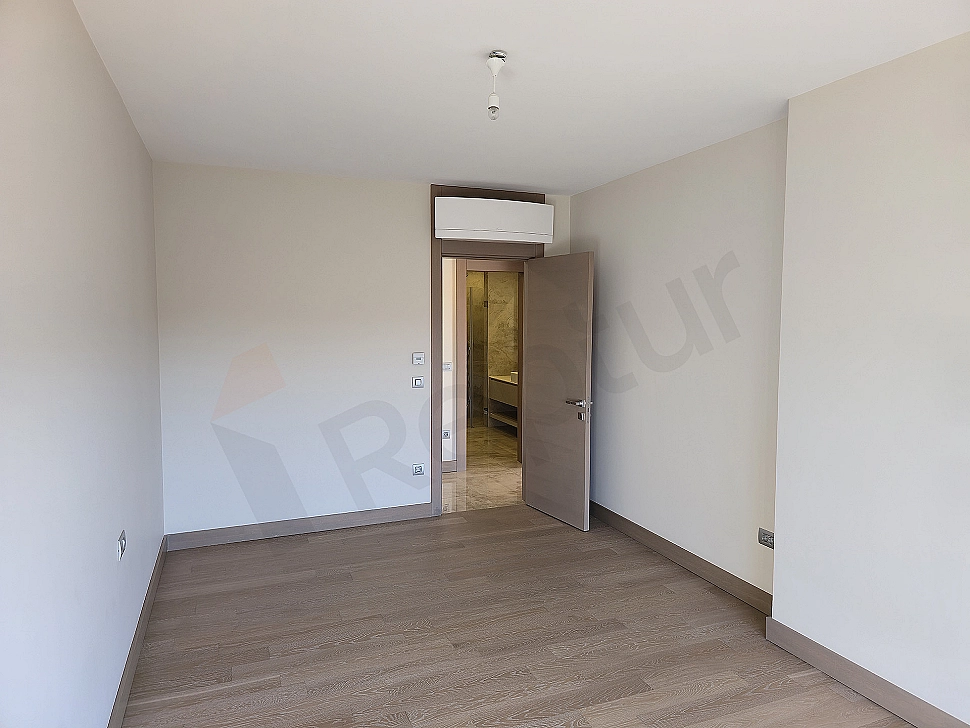 Stylish and modern designed bedroom interior with luxurious details and comfortable bed.