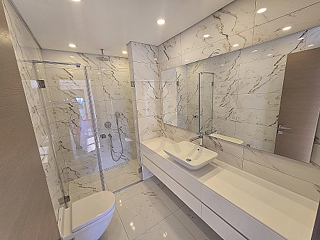 Modern designed, spacious and bright duplex apartment bathroom. Luxury fixtures and ceramic details.