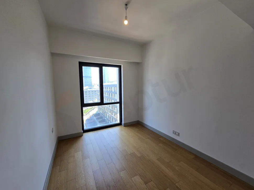Spacious bedroom view of a modern and bright apartment