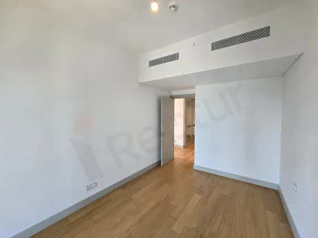 Modern and bright bedroom interior of a 1+1 apartment for sale in Sisli.