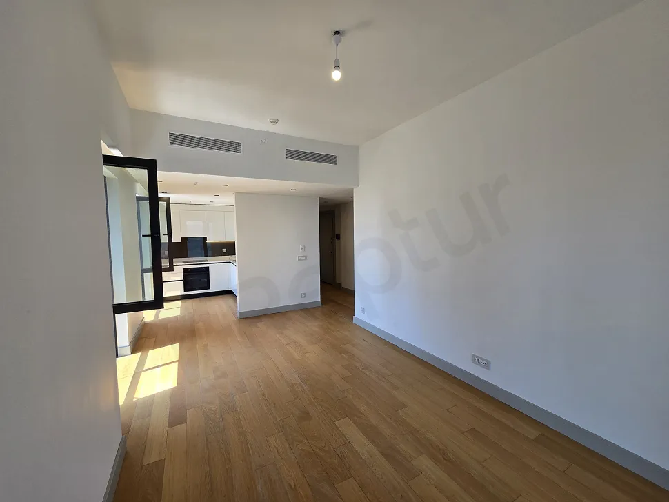 Spacious and bright dining room area of a modern apartment.