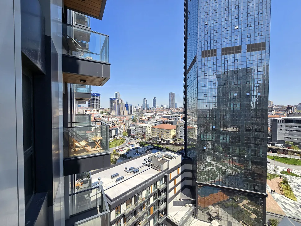 Spacious and airy balcony of a modern apartment in Sisli with a city view.