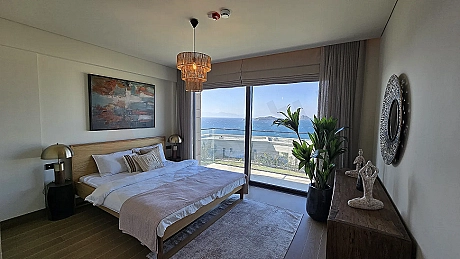 Modern designed and spacious bedroom area with natural light in a luxury seafront villa in Bodrum.