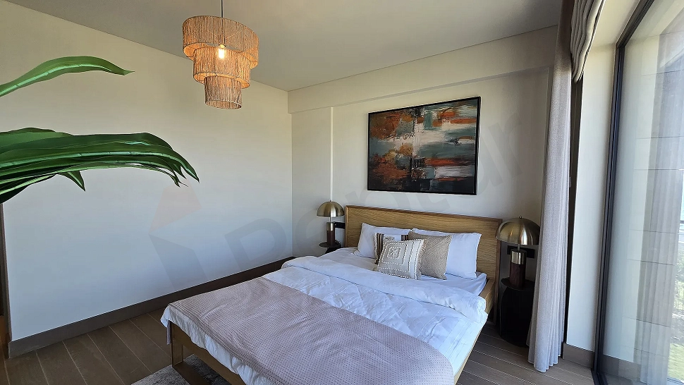 Modern and spacious bedroom area with large windows in a luxury villa in Bodrum.