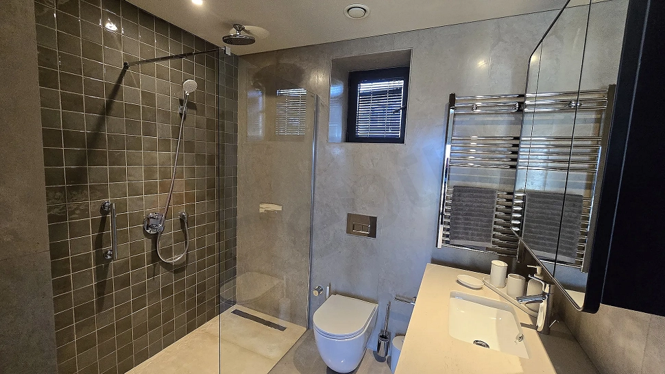 Modern designed, spacious and bright villa bathroom visual.