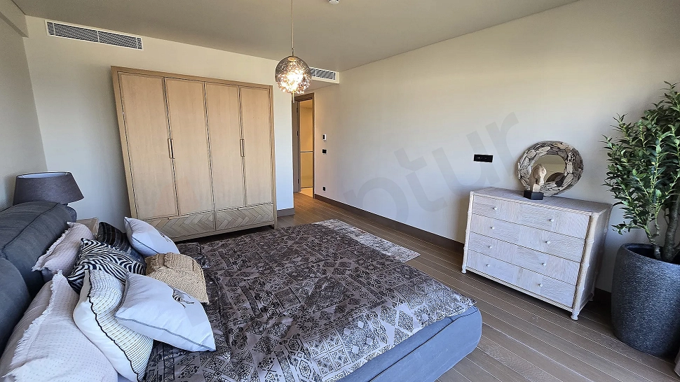 Modern and spacious bedroom design with natural light in a luxury villa in Bodrum.